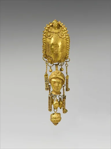 Earring with pendants and female head