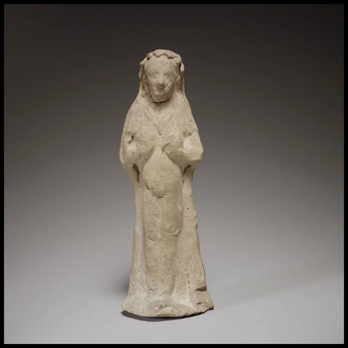 Terracotta statuette of a woman — Unknown