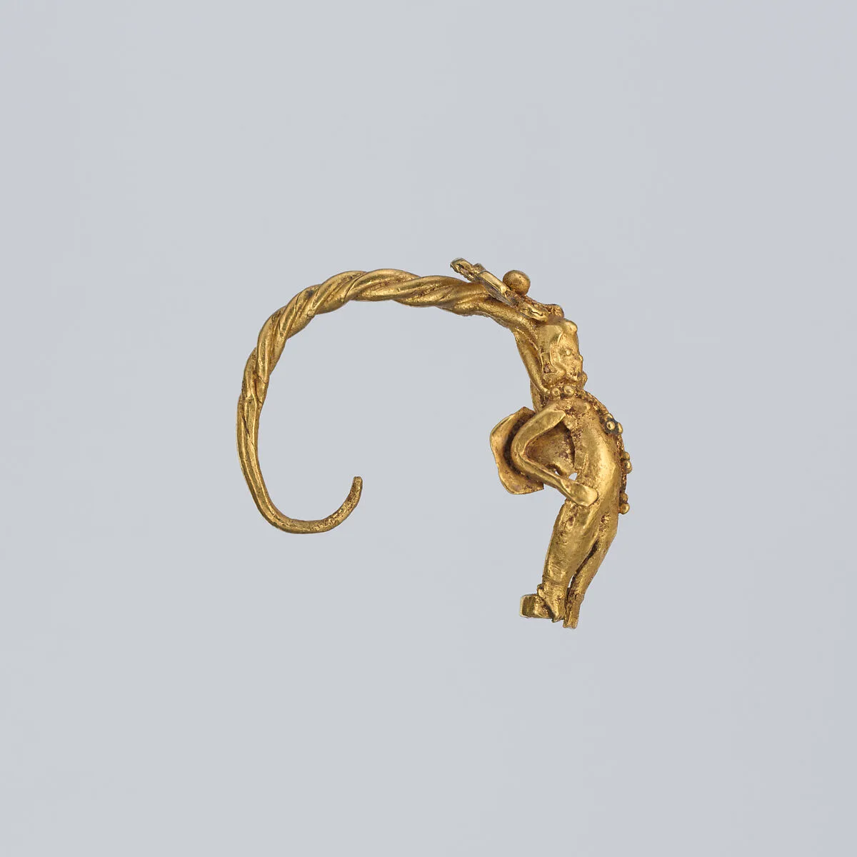 Gold earring with winged figure (one of a pair) — Unknown