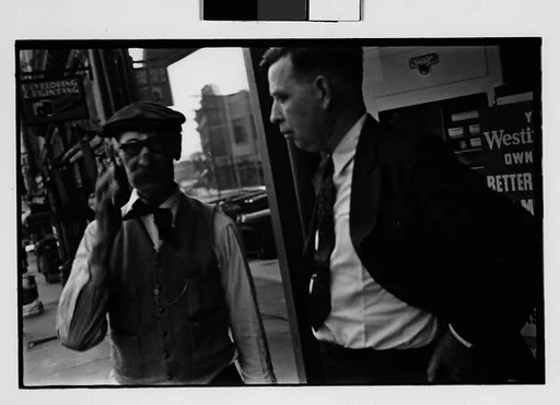 [Two 35mm Film Frames: Two Men on Sidewalk, Ossining, New York]