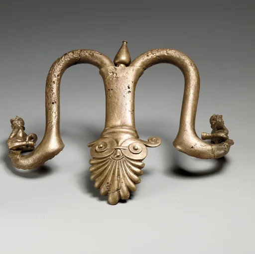 Handles and feet of a bronze louterion (basin)