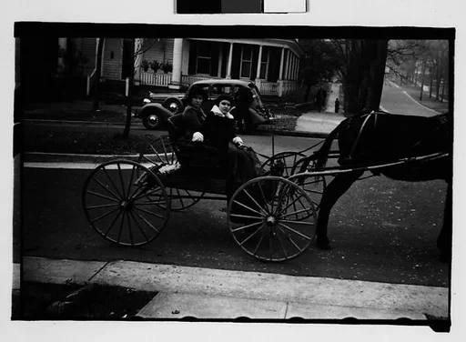 [Two Young Women in Horse-Drawn Carriage, Milledgeville, Georgia]