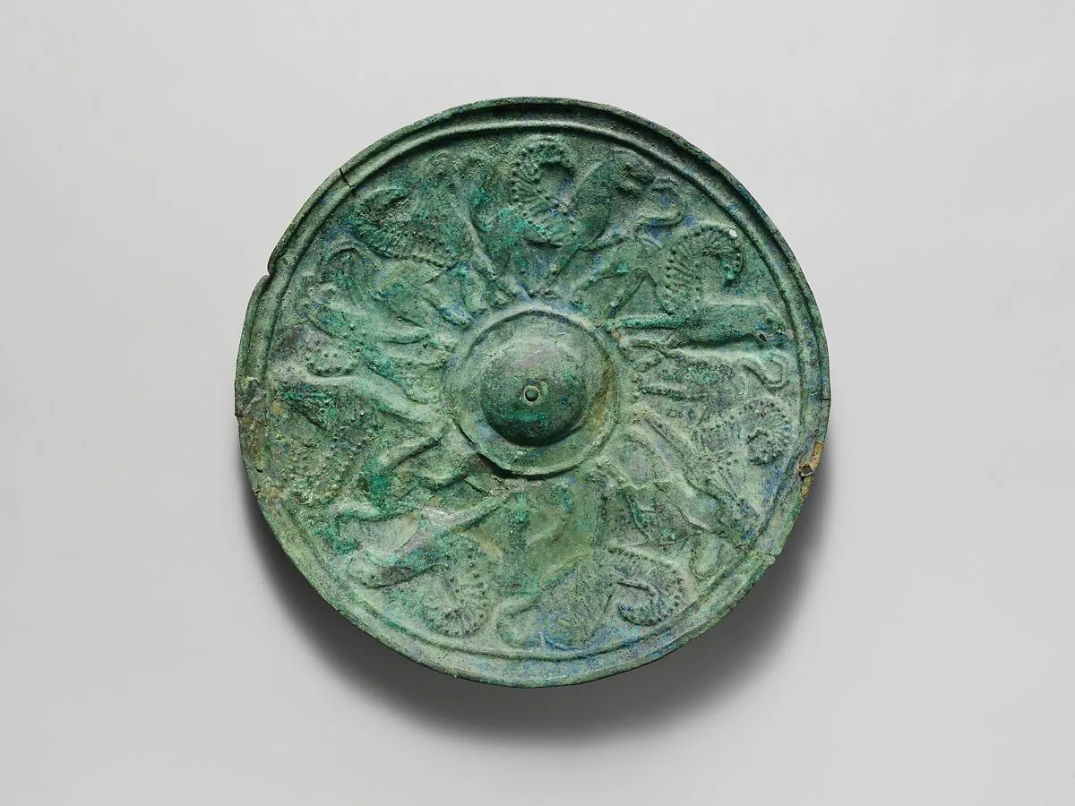 Bronze shield boss with griffin and sphinx frieze — Unknown