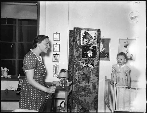 [Unidentified Woman with Baby in Crib]