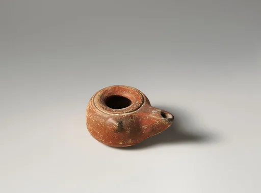 Terracotta oil lamp
