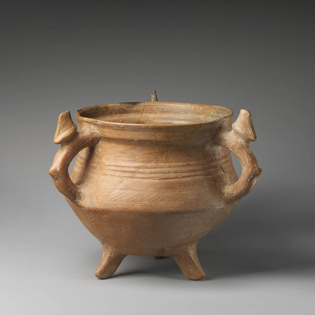 Tripod vessel with three animal-shaped handles — Unknown