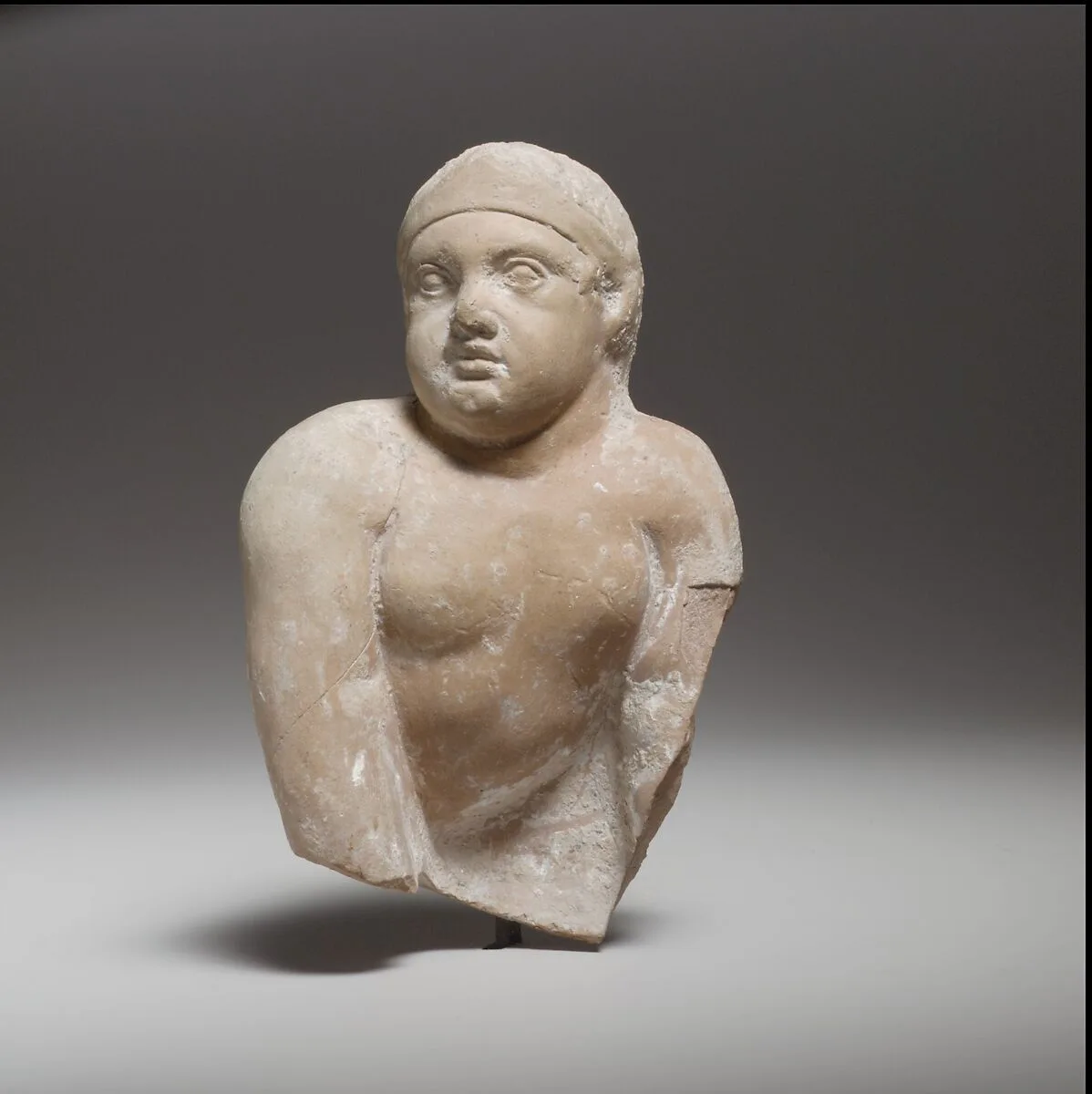 Terracotta statuette of a seated or crawling boy — Unknown