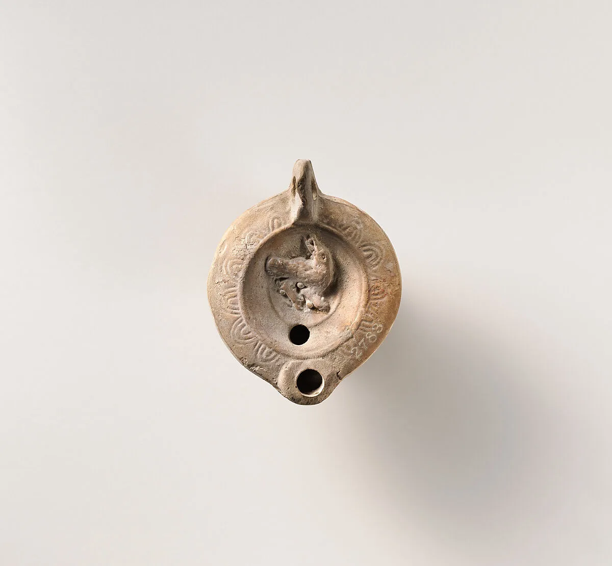 Terracotta oil lamp — Unknown
