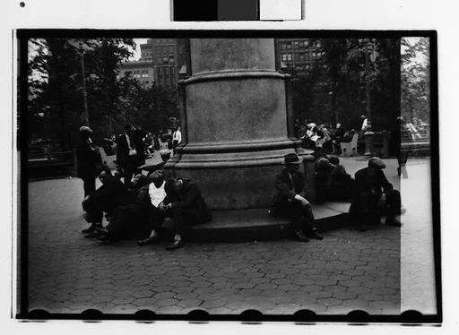 [Two 35mm Film Frames: Men Seated Around Statue Base, Union Square Park, New York City]