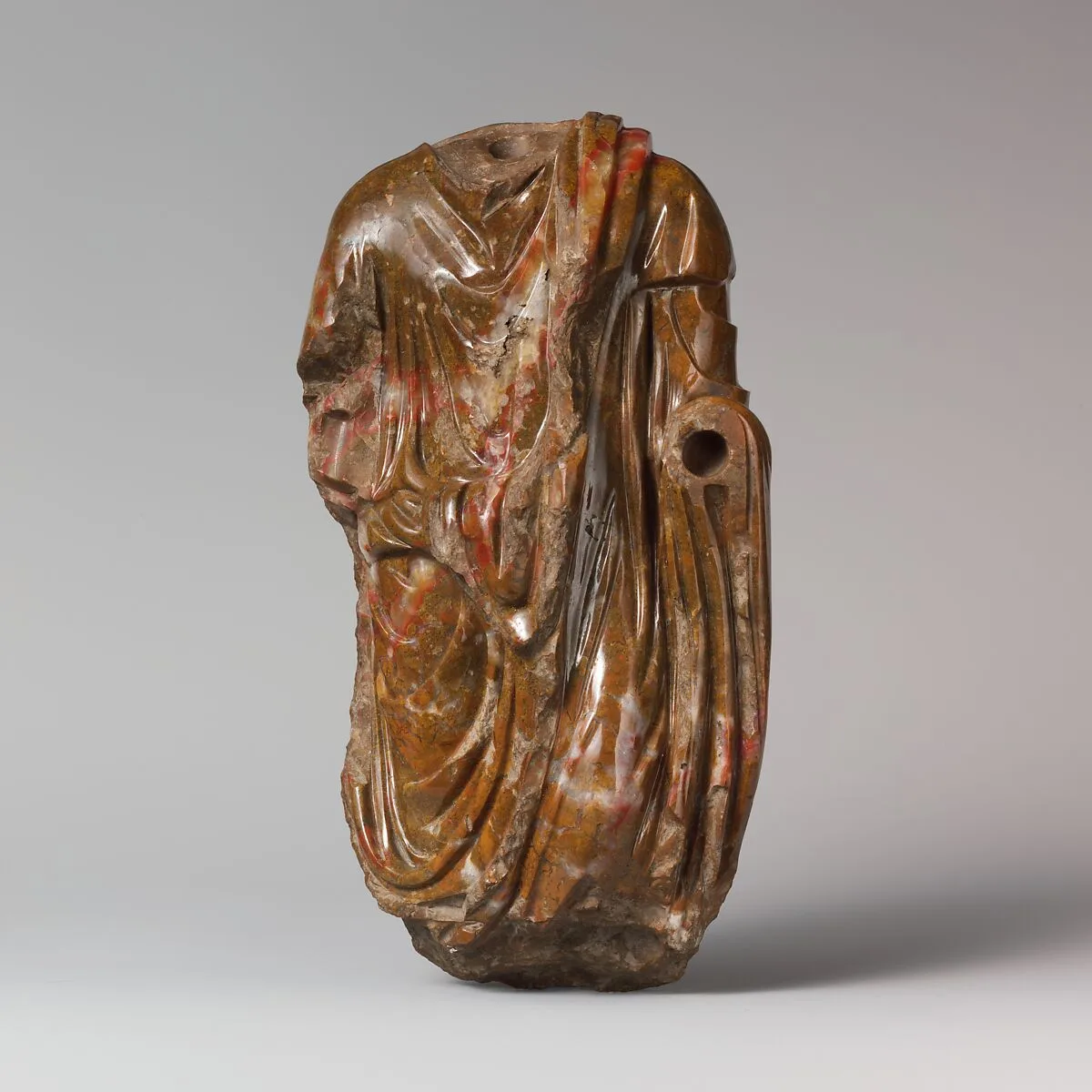 Jasper statuette of a man wearing a toga — Unknown