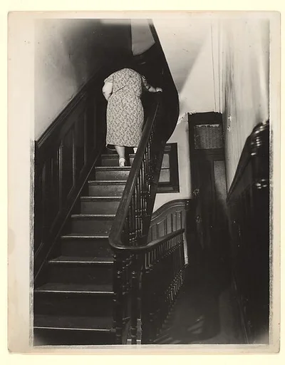 [Woman Ascending Stairs of Apartment Building, New York]