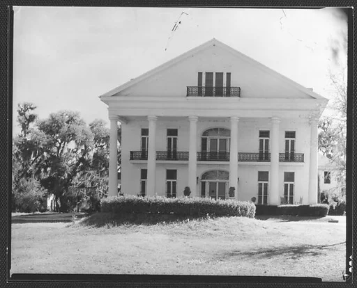 [Greek Revival House with Balcony in Full-Façade Gable]
