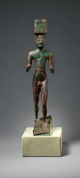 Man carrying a box, possibly for offerings — Unknown