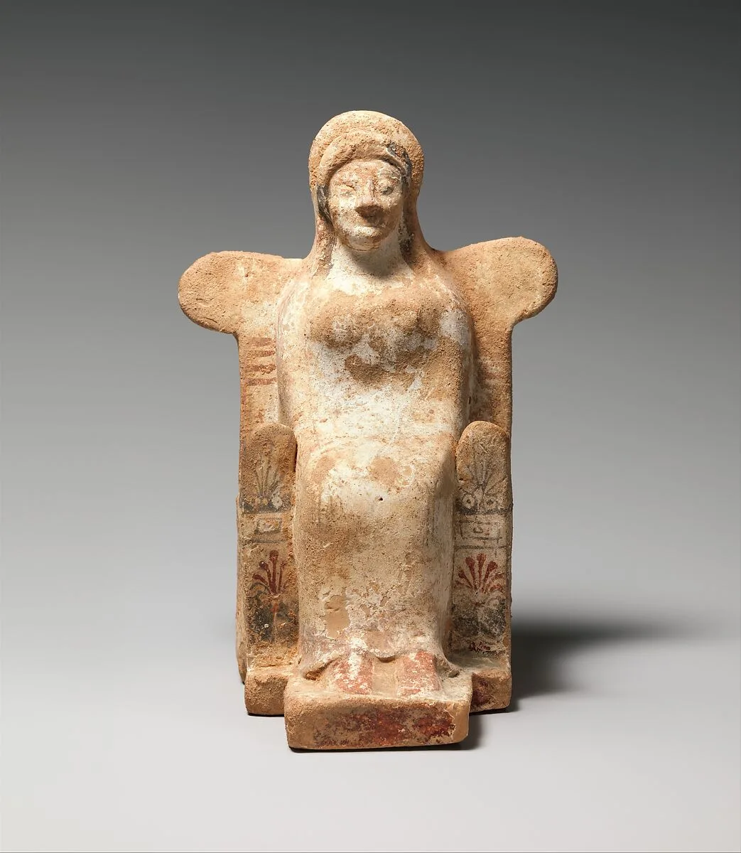 Terracotta statuette of a seated woman — Unknown