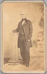 [Fernando A. Evans Standing, Hand on Column]