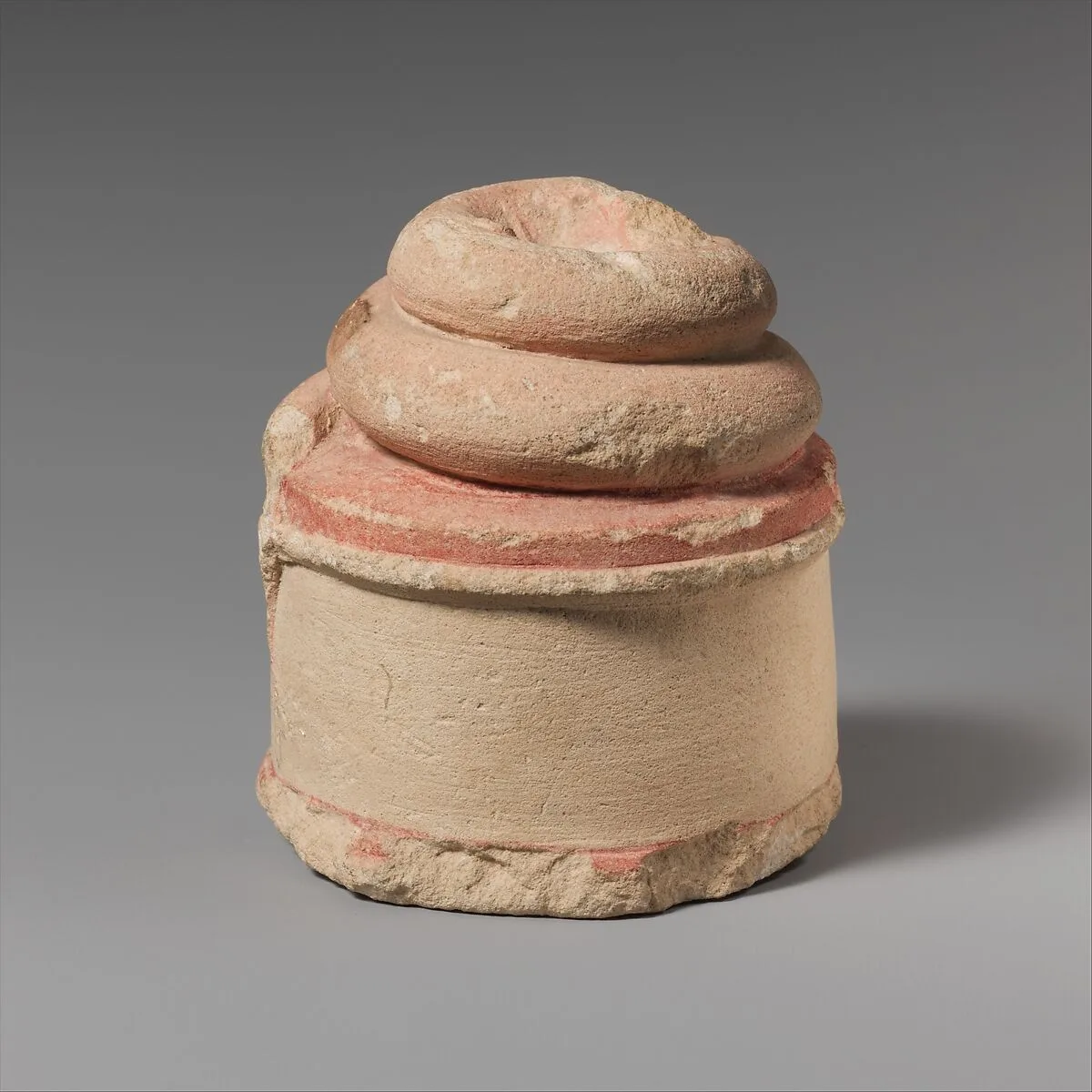 Limestone altar or pedestal with coiled snake — Unknown
