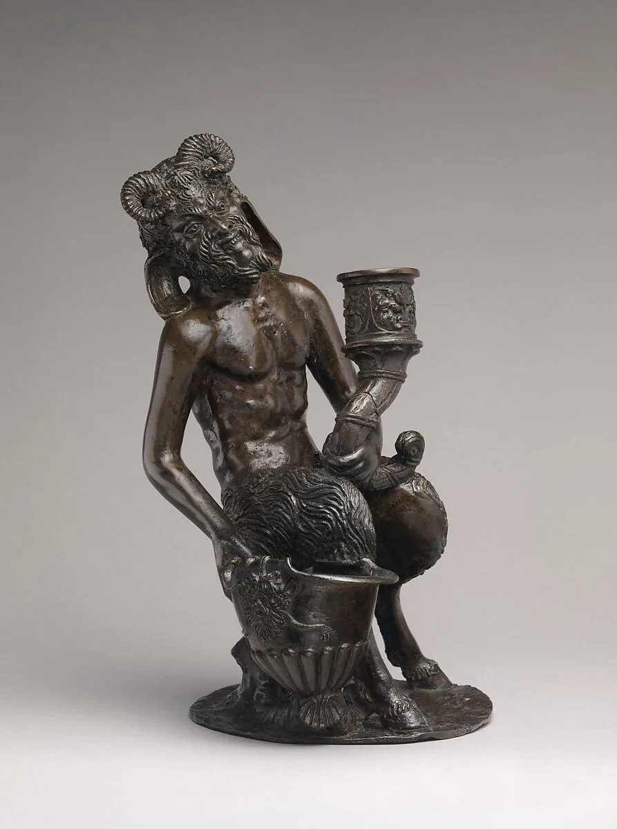 Seated satyr with an inkwell and a candlestick — Unknown