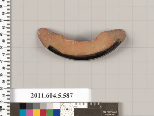 Terracotta fragment of a stemless kylix (drinking cup)
