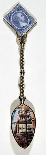 Souvenir spoon with view of a street scene and finial in form of a postage stamp