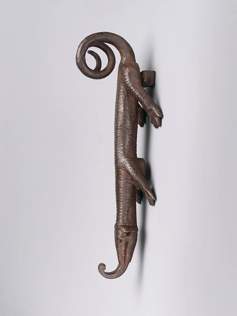 Door knocker in the shape of a lizard-like creature — Unknown
