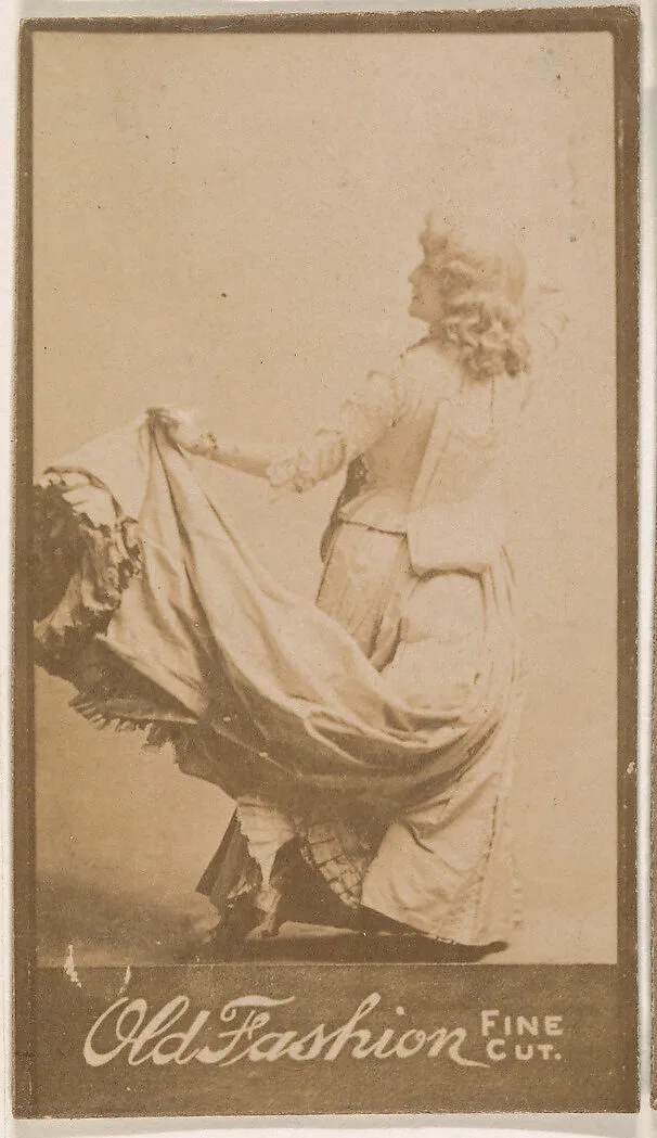 Actress holding up part of costume, from the Actresses series (N664) promoting Old Fashion Fine Cut Tobacco — Unknown