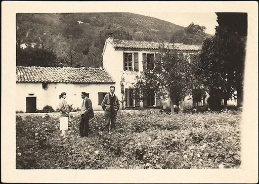 [Lucien Jacques, Georgette Maury, and Léon Berthier Standing in Garden in Front of French Country-Style House, Cyprés de St. Jean par Grasse, France]