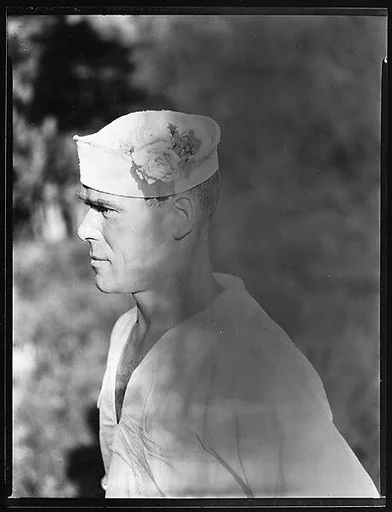 [South Seas: Cressida Crew Member with Rose in Cap]