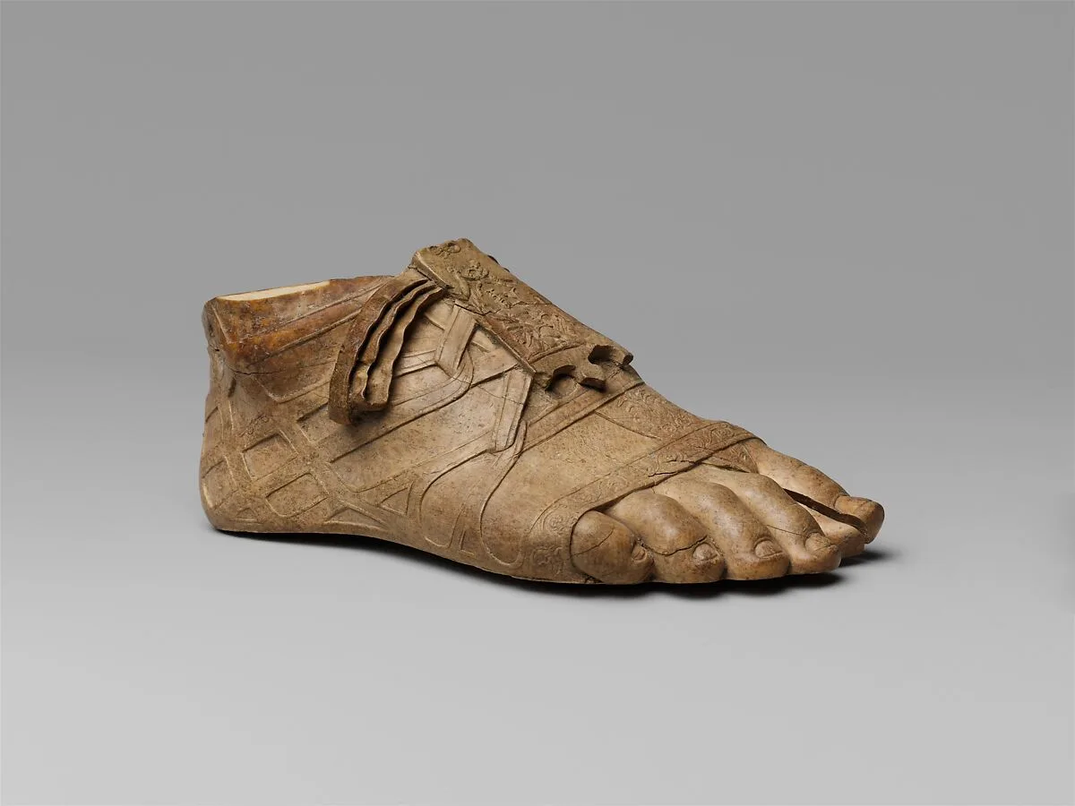Ivory sandaled foot — Unknown