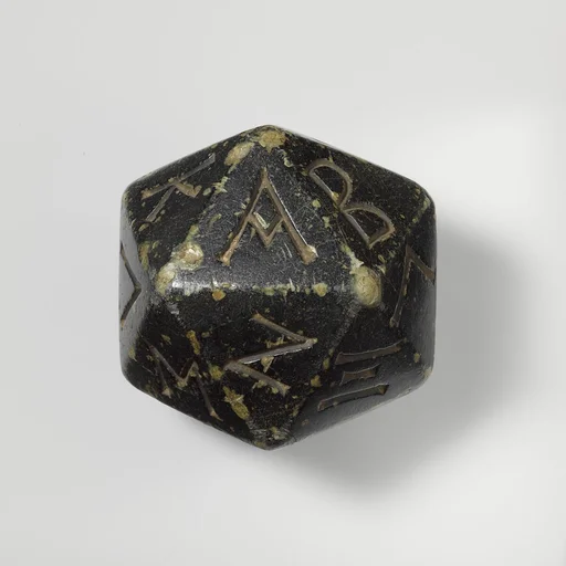 Greenstone polyhedron inscribed with letters of the Greek alphabet