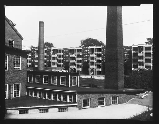 [Factory Buildings and Smokestacks in Front of Apartment Buildings, Windsor, Vermont]