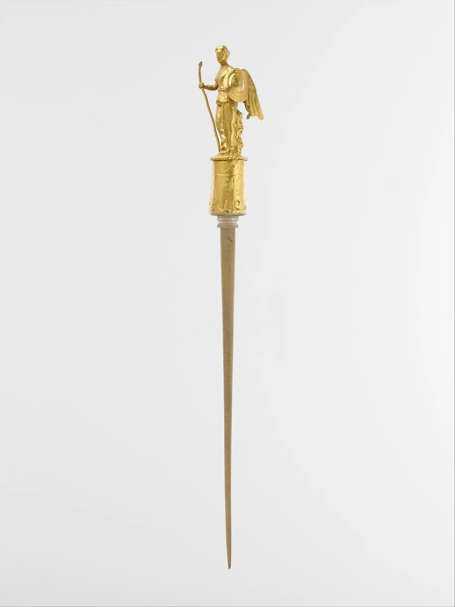 Gold head of a pin with the figure of Nike (Victory) — Unknown