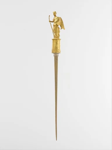 Gold head of a pin with the figure of Nike (Victory)