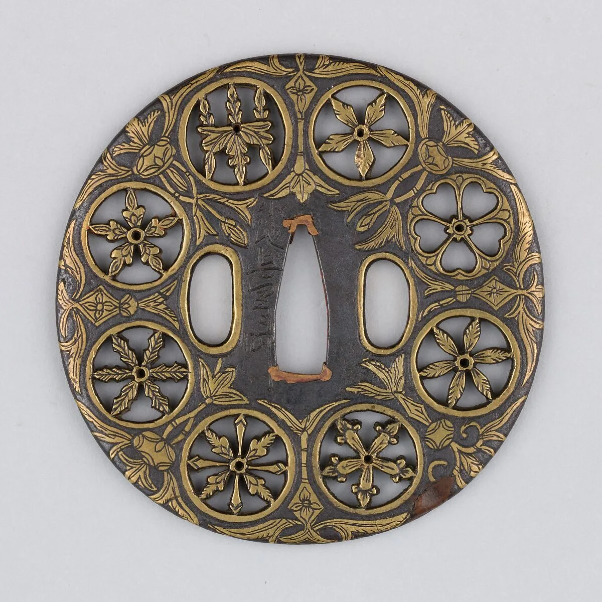 Sword guard (<i>Tsuba</i>) Depicting Crests and Arabesques (家紋散唐草文鐔) — Koike Izumi no Kami Naomasa