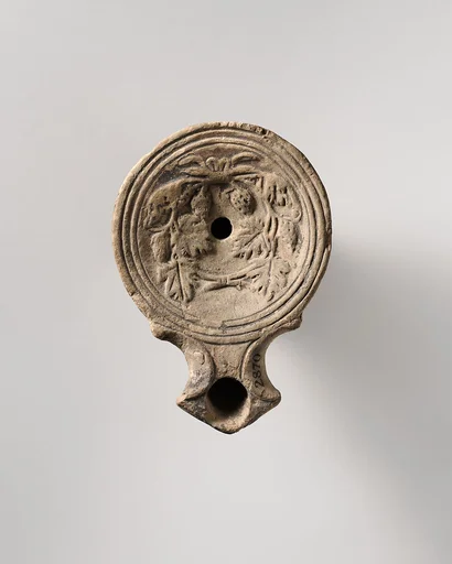 Terracotta oil lamp