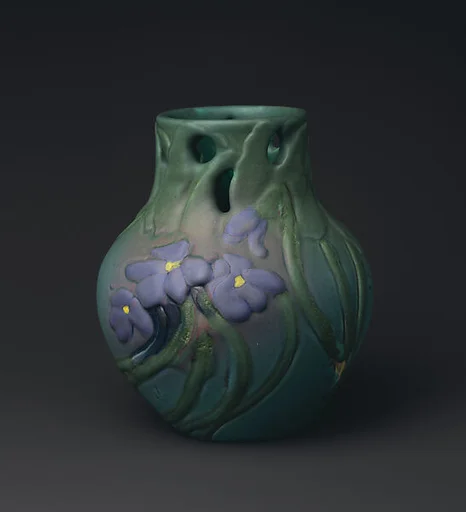 Vase with violets