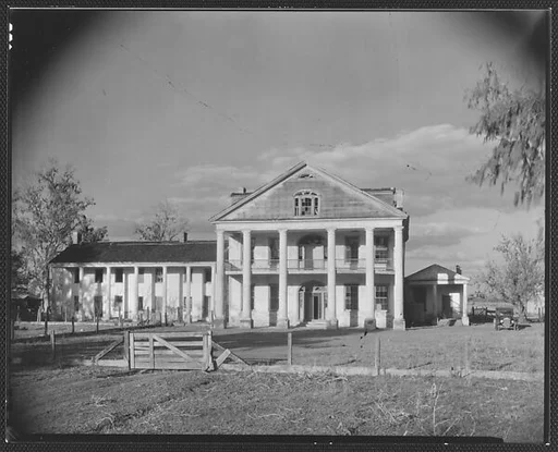 [Dilapidated Greek Revival Plantation House with Broken Windows in Gable, Louisiana?]
