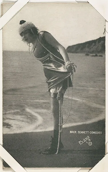 Bathing beauty in costume with strands of pearls from Mack Sennett Comedies Arcade series (W423) — Unknown
