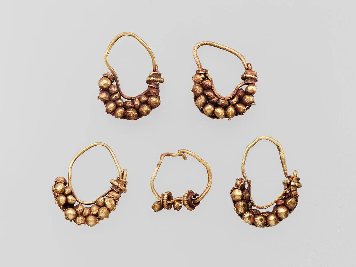 Five gold earrings with spherical elements — Unknown