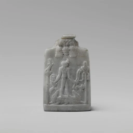 Miniature Cippus (magical stela) with Horus in profile wearing gazelle head on the forehead