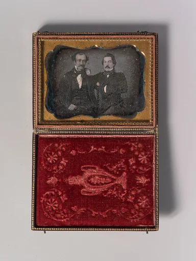 [Two Men with Mustaches, Arms Around Each Other]