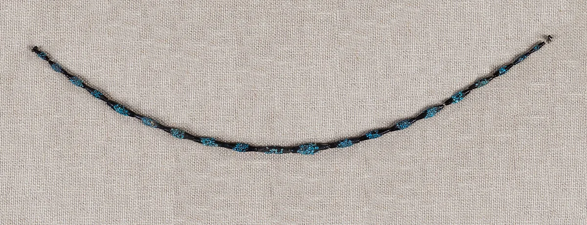String of black faience beads with encrustations — Unknown