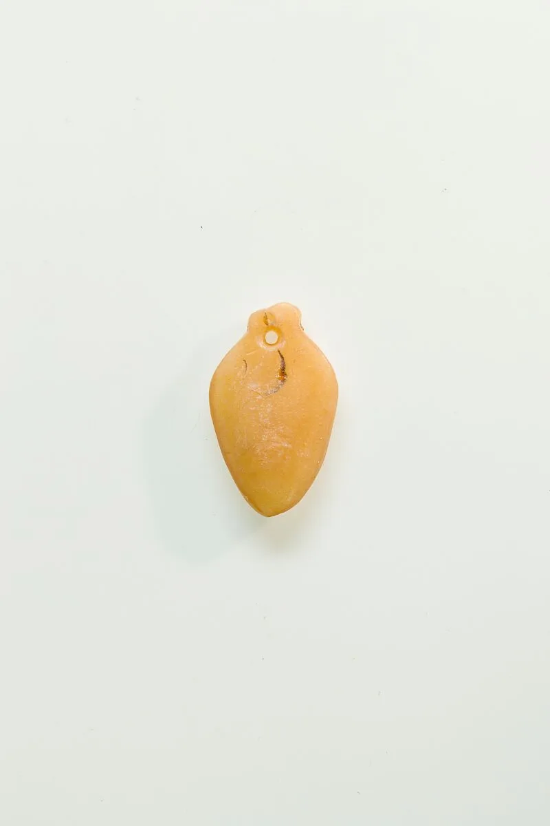 Heart (ib) from string of amulets — Unknown