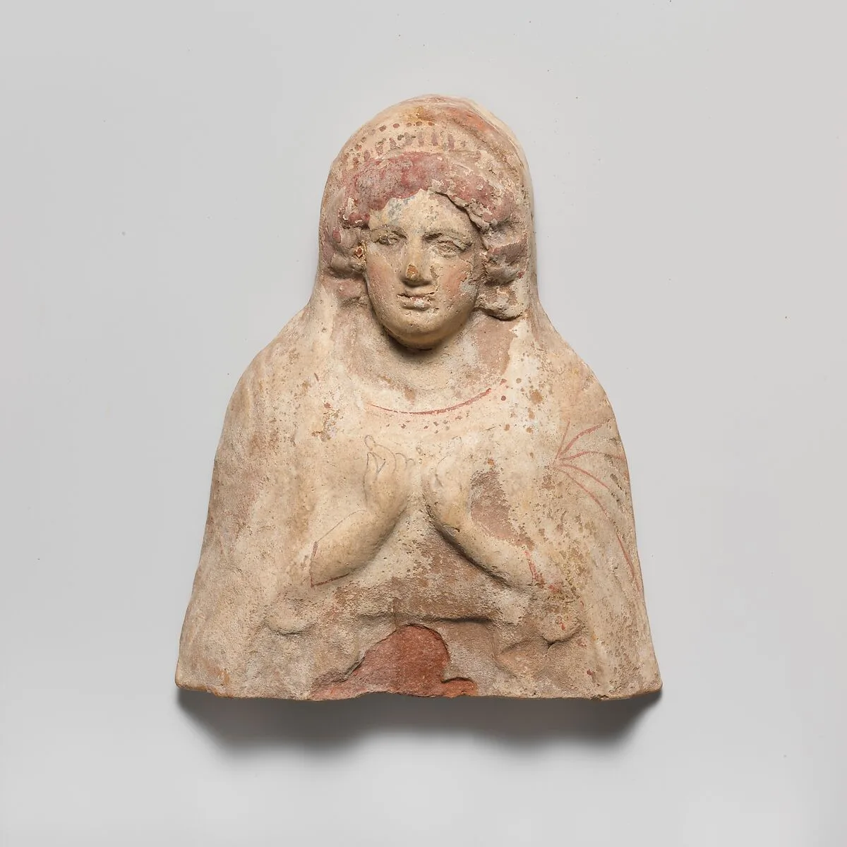 Terracotta relief bust of a woman — Unknown
