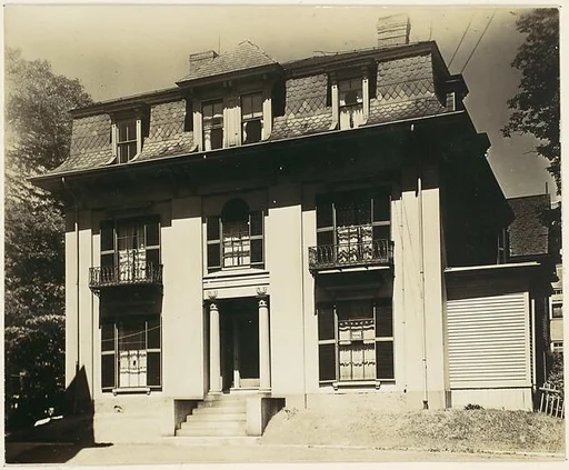 [Victorian Architecture: House with Fluted Columns and Mansard Roof]
