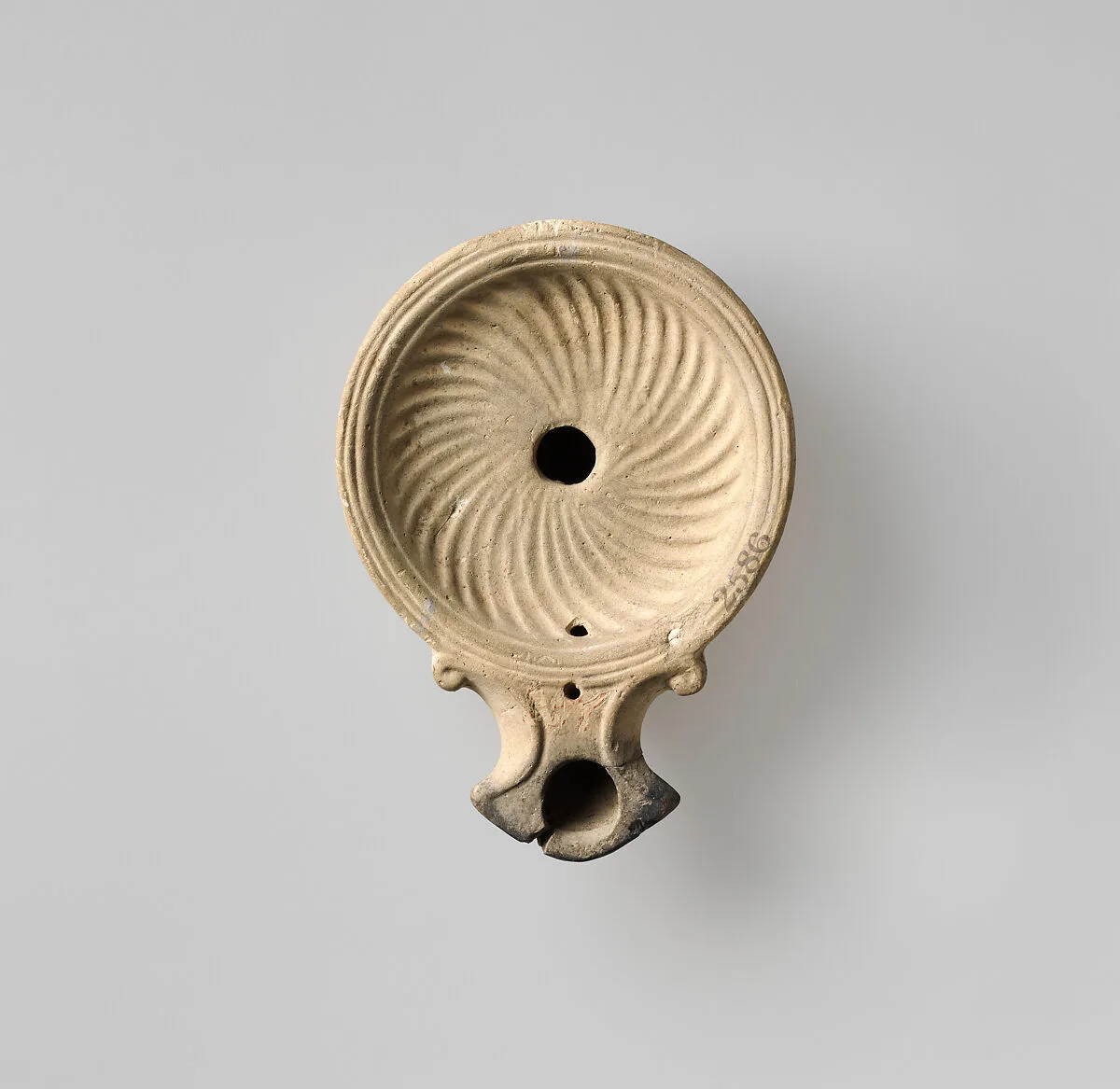 Terracotta oil lamp — Unknown