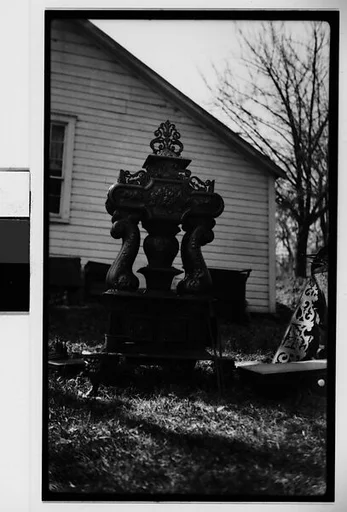 [Victorian Garden Statuary on Lawn Outside Clapboard House]