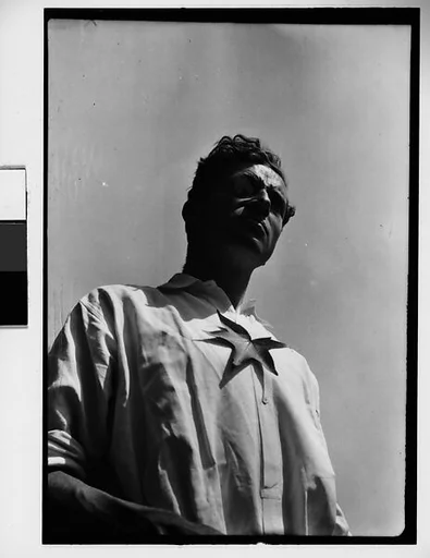 [Paul Grotz with Leaf on Chest, From Below]