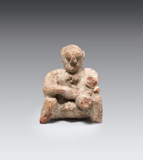 Figurine of a seated man