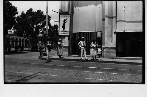 [Street Scene with Pedestrians Under Symphony Poster, Havana]