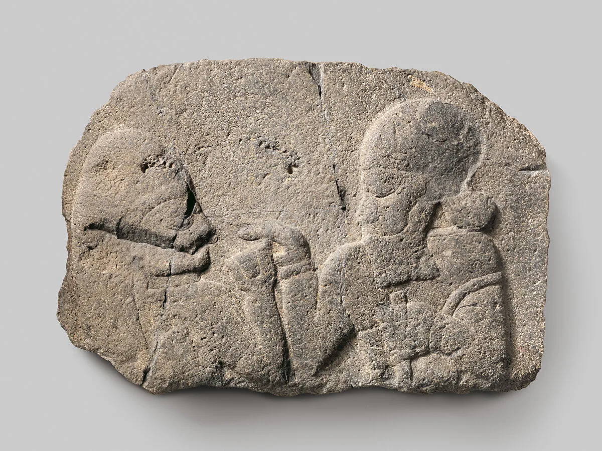 Relief: man holding up a cup to a woman — Unknown